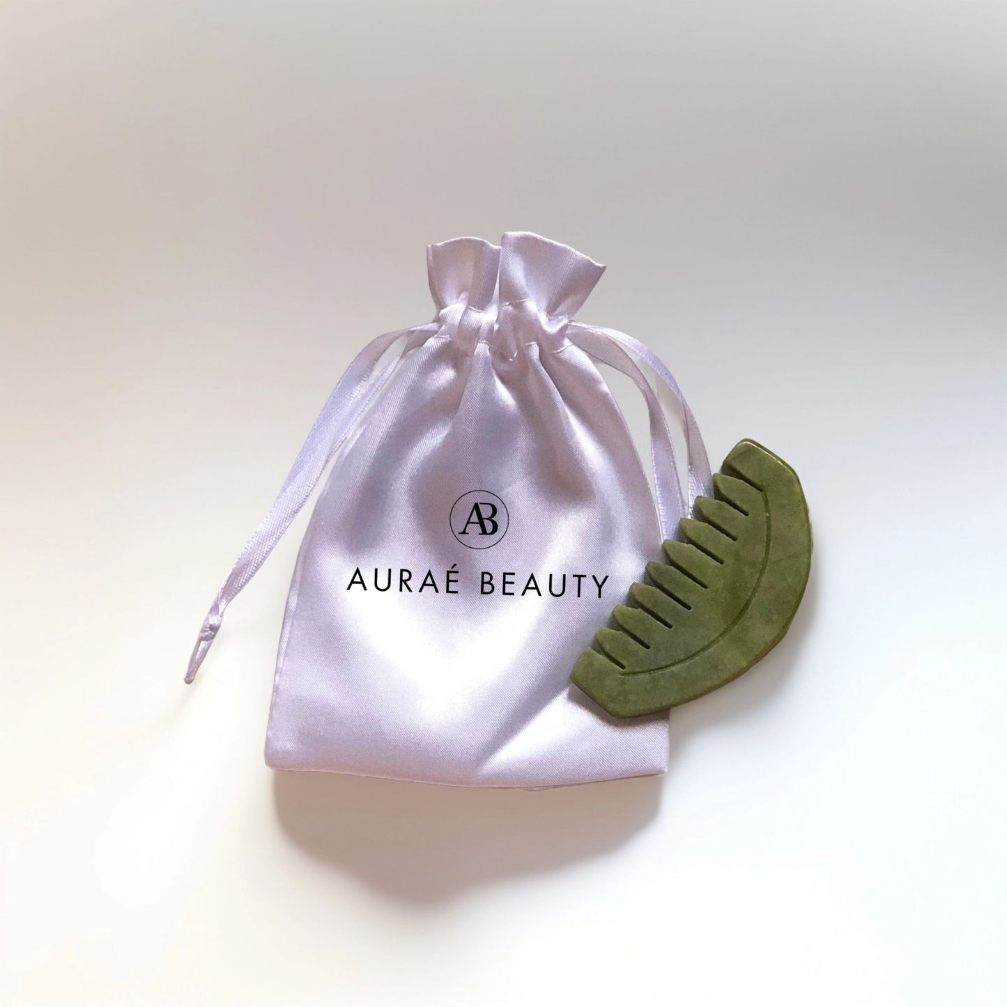 Auraé Beauty's jade gua sha comb for head massage, better blood circulation, improved mental health
