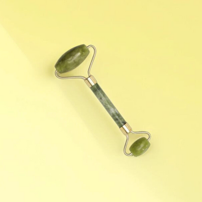 Natural jade roller with two different sized rollers used for skin care and face lifting.