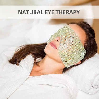 Person wearing a jade eye mask for natural eye therapy.