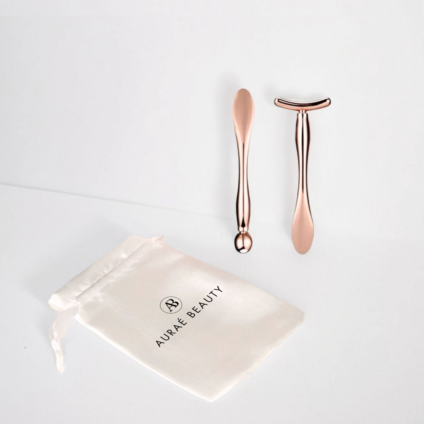 Rose gold metal facial massage tools - T shape and pointed one for under eye and face skincare. Best for product absorption.
