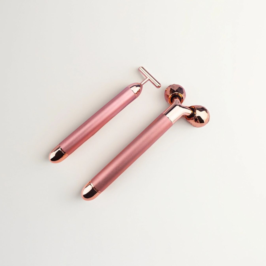 A rose gold-colored 2-in-1 electric facial massager with a T-shape bar and a 3D roller.
