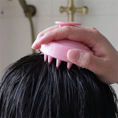 Close of scalp massager using it on the scalp