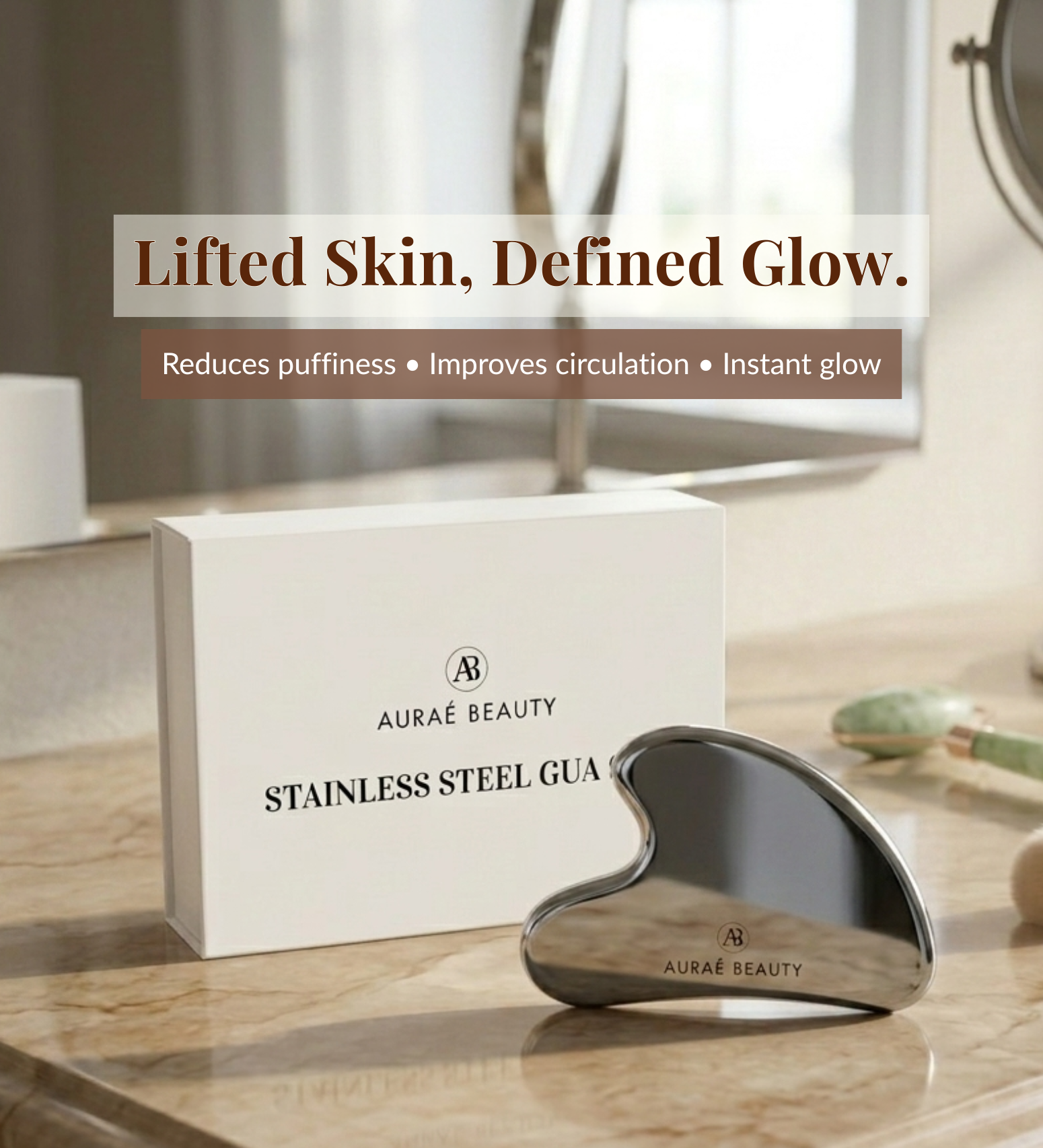 Auraé Beauty stainless steel gua sha tool for lifted skin, defined glow and sculpted face.