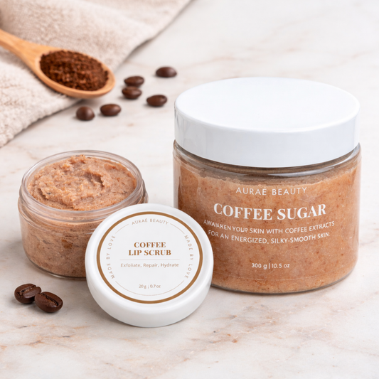 Coffee Glow Kit by Auraé Beauty that includes coffee sugar body scrub and coffee sugar lip scrub for soft, smooth skin and pink, hydrated lips.