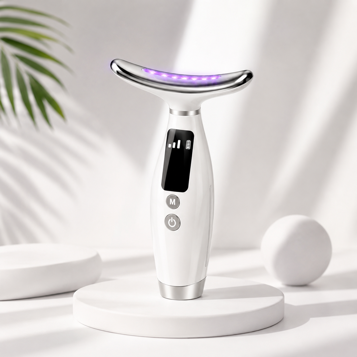 A handheld LED neck lifting and skin tightening device by Auraé Beauty with a digital display and multiple color settings for face lifting, sculpted face, sleek jawline.