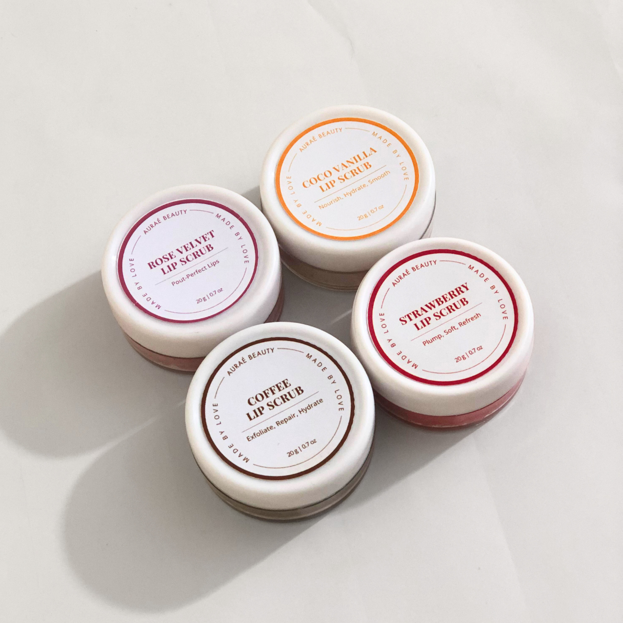 Sugar Lip scubs by Auraé Beauty that are made of 100% Organic sugar lip scrubs for soft, smooth, plumpy, hydrated and rosy lips naturally.
